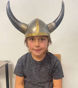 Elementary boy wearing viking hat